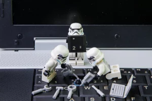 people fixing laptop keyboard